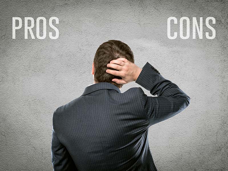 Pros and cons man scratching head thinking