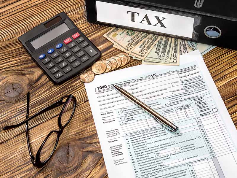 Are renewable energy systems exempt from property tax in Wisconsin? tax papers and money on desk