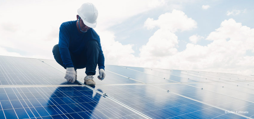 Man installing solar panels