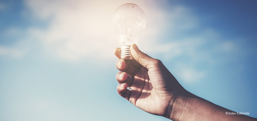 Man holding a light blub