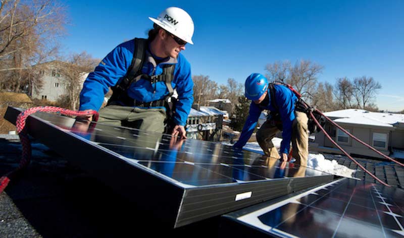 Installing solar. Courtesy SolarReviews