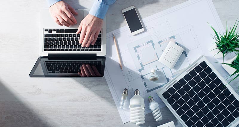 Solar panel and man on laptop